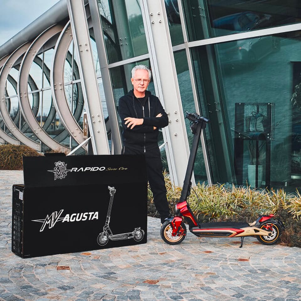 Horacio Pagani with a Rapido Serie Oro kick scooter